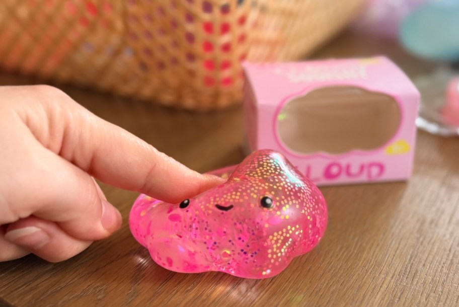 hand poking pink cloud squishy