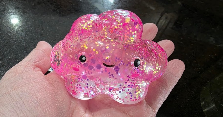 pink sparkly cloud shaped squishy in hand