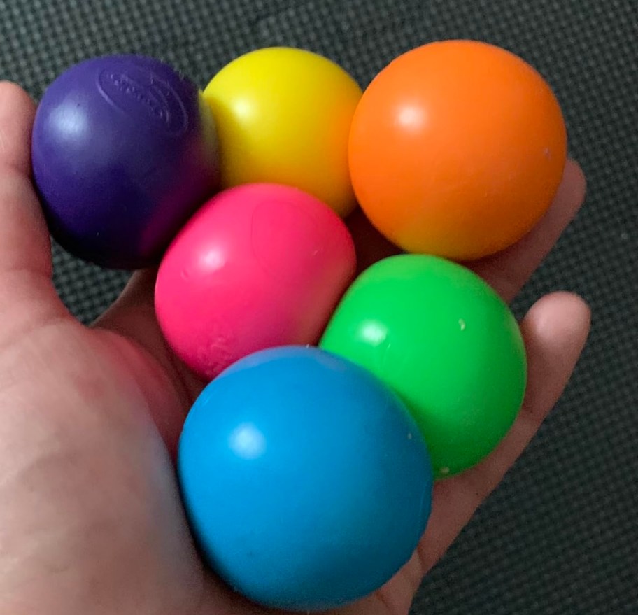 hand holding rainbow colors of gobbles