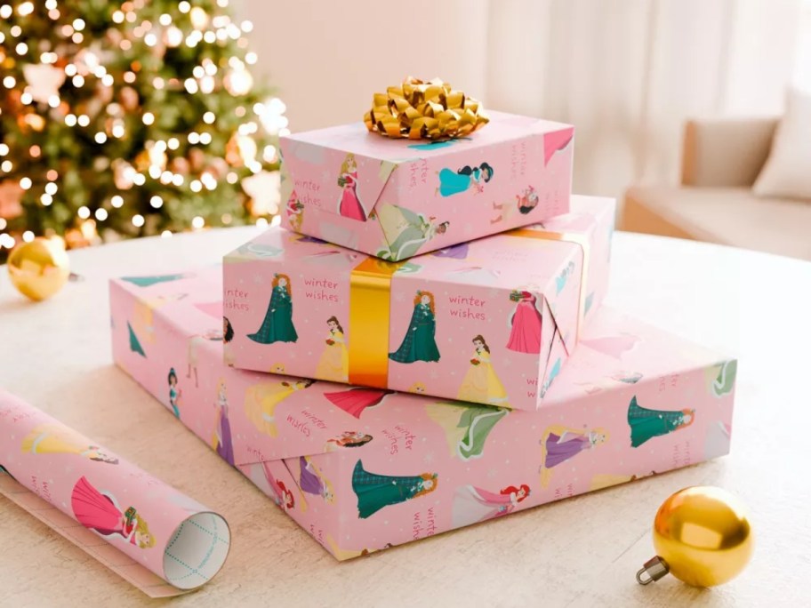 3 gifts wrapped in pink Disney Princess paper