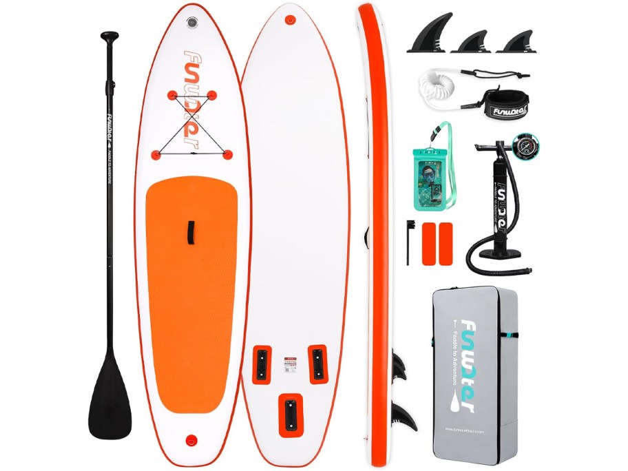 white and orange paddleboard with accessories 