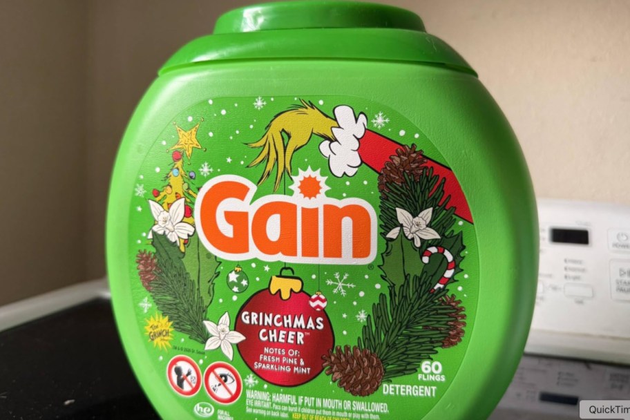 green tub of gain detergent pods with grinch on it
