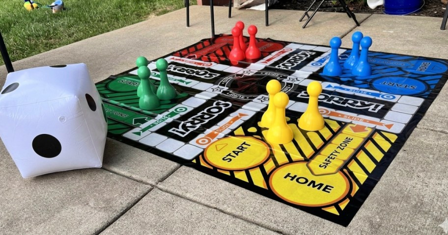 giant sorry game on patio next to large dice