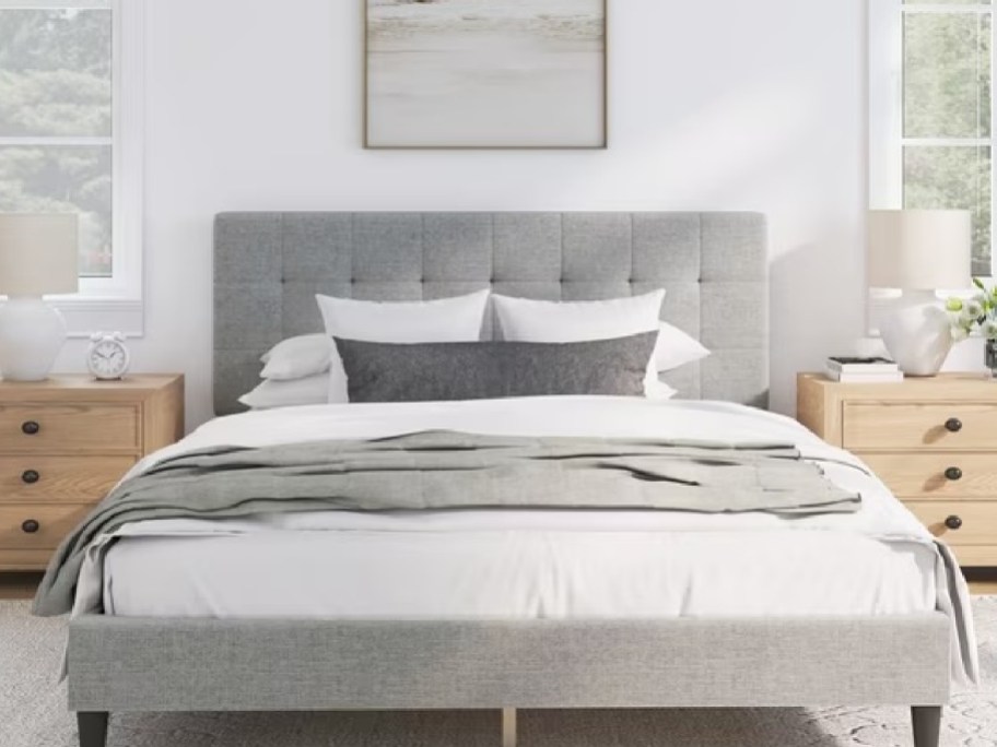 gray bed with white bedding