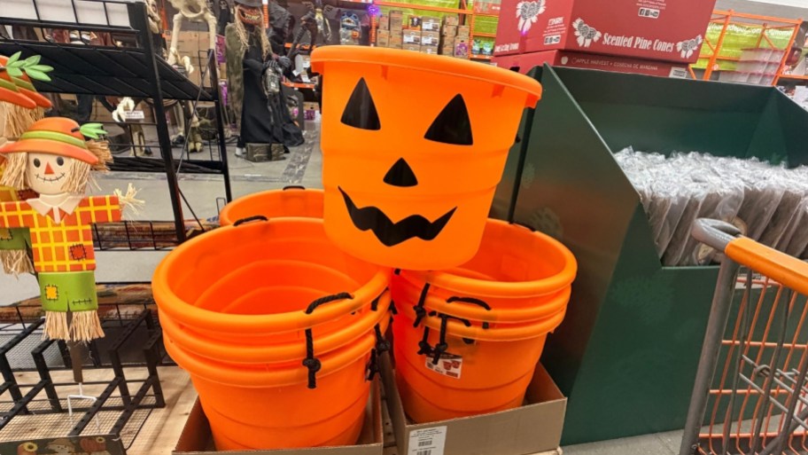 huge orange jack o lantern bucket on display in a store