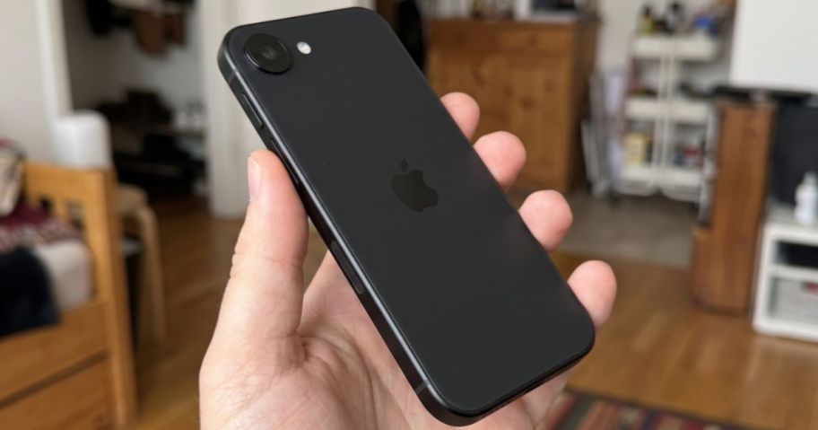 Hand holding a Black iPhone 16e