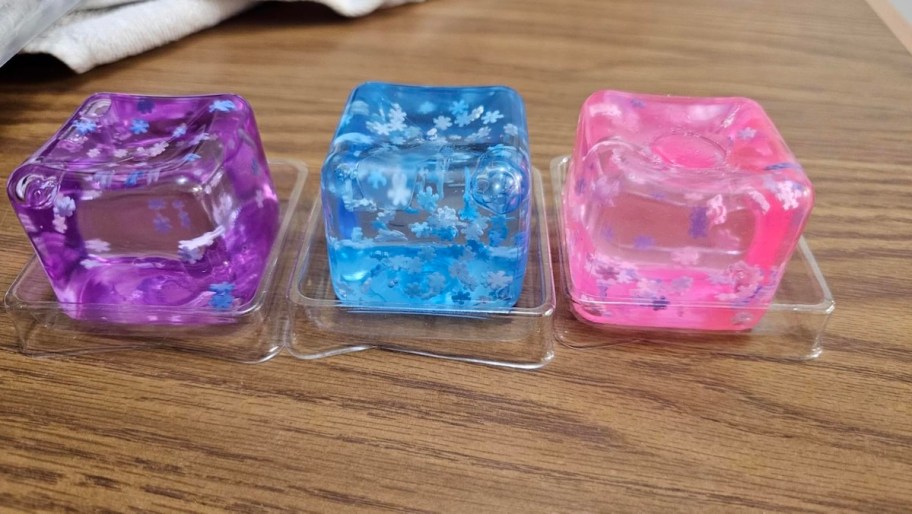Row of purple blue and pink ice cube squishies
