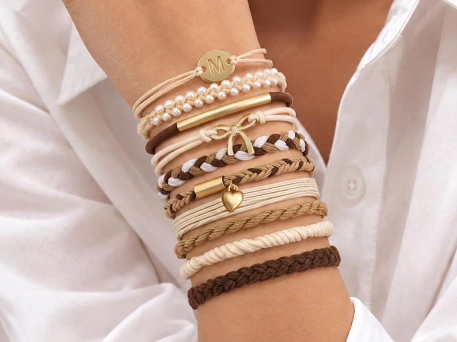 hand wearing inital bracelet