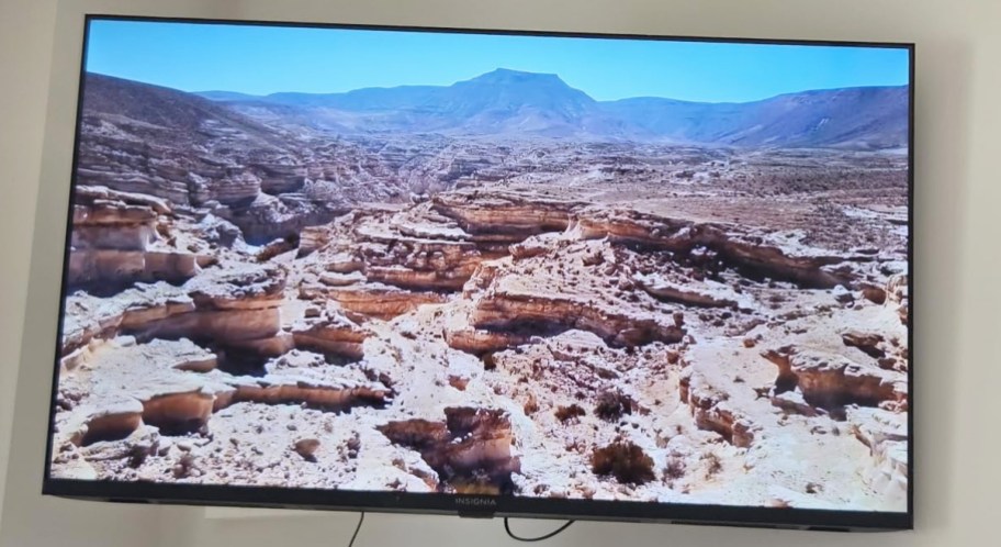 large tv hanging on wall