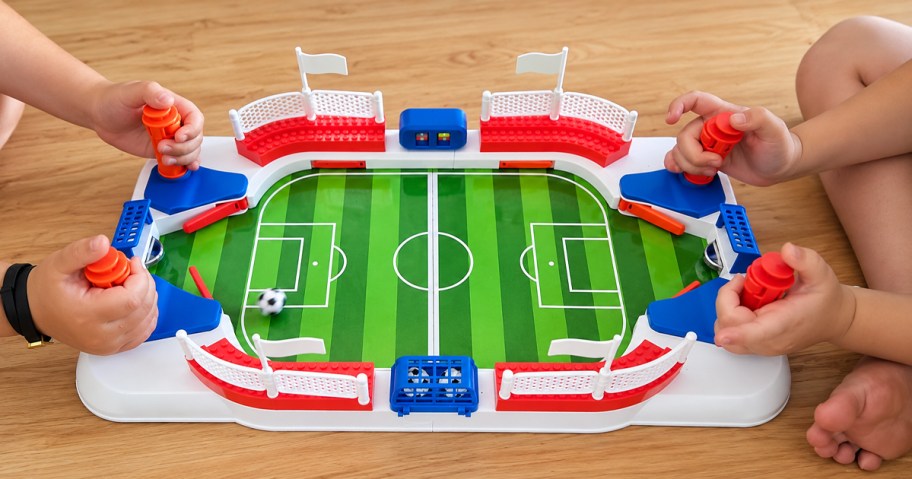 two kids playing mini soccer game
