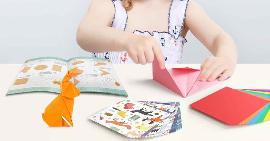 girl playing with origami