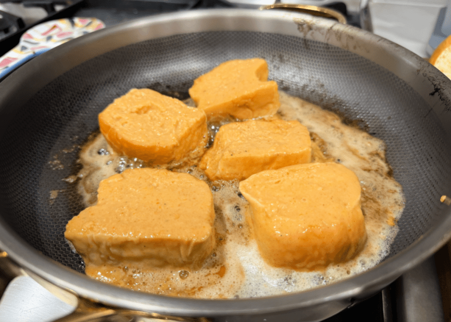 kings Hawaiian rolls french toast in a frying pan