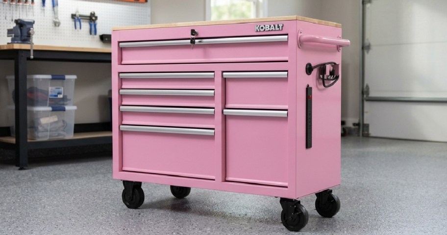 pink workbench with drawers in a garage