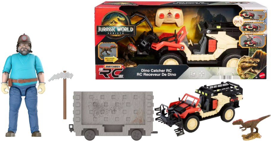 A Jurassic World Matchbox Dino Catcher RC set featuring a toy action figure, a pickaxe, a gray minecart, a remote-controlled red and beige utility vehicle, and a dinosaur figurine.
