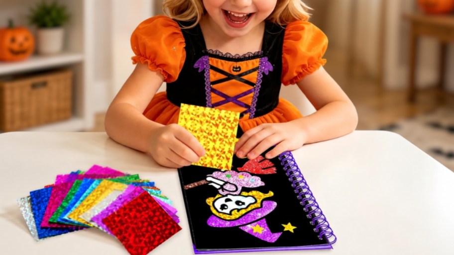 little girl creating foil art