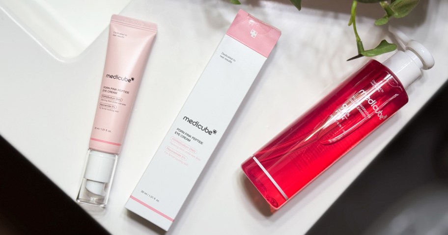 tube of medicube PDRN Pink Peptide Eye Serum on bathroom counter