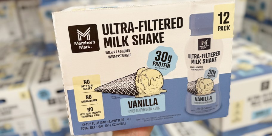 hand holding box of vanilla shakes 