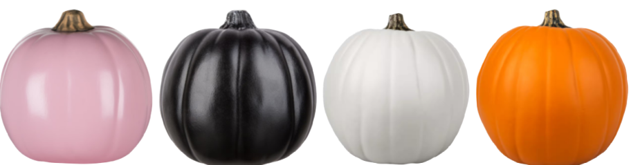 row of craft pumpkins in pink, black, white, and orange