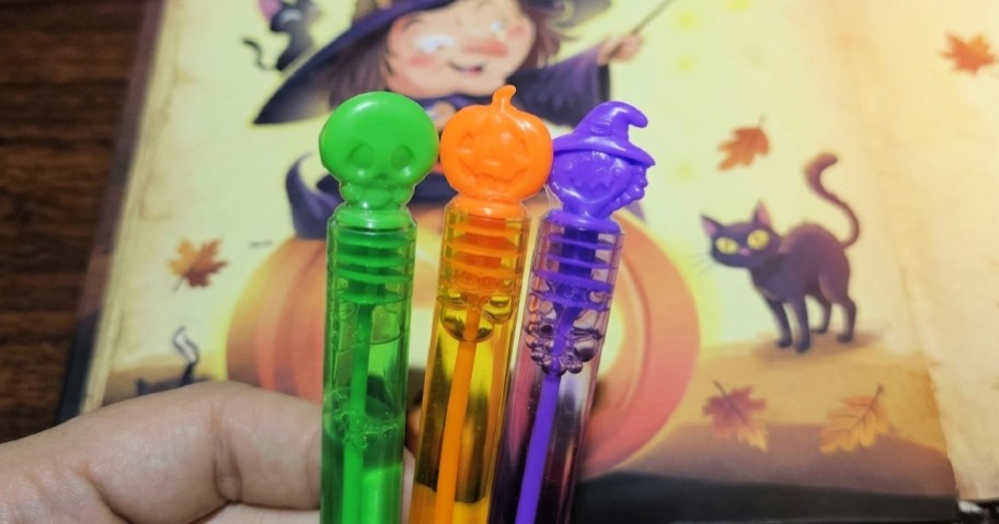 halloween bubble wands in a hand