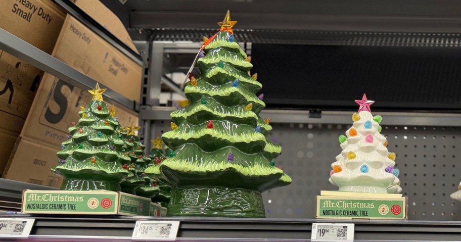 Mr. Christmas ceramic Christmas trees on a store shelf