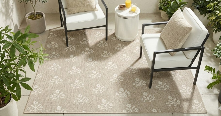 beige area rug on a patio with patio furniture