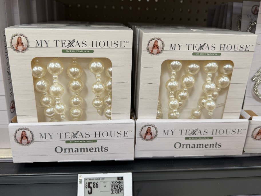 boxes of white ornaments on store shelf