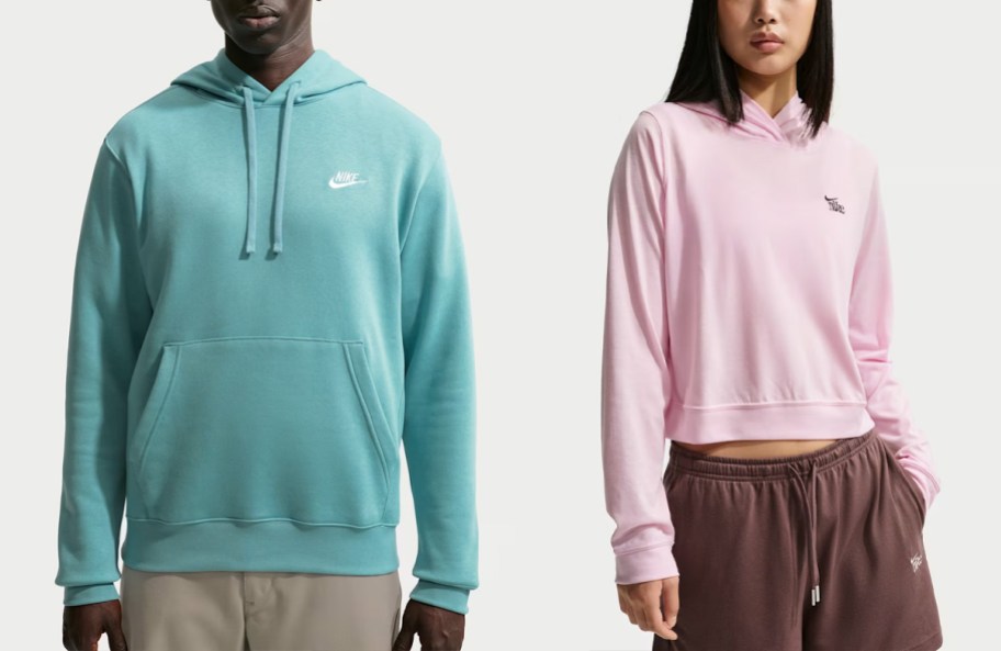 man wearing blue and woman wearing pink hoodies