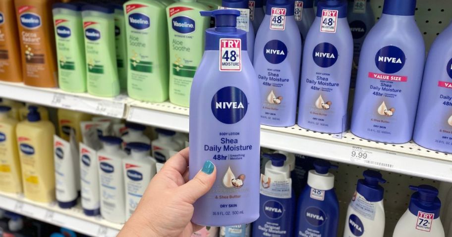 hand holding nivea body lotion in store
