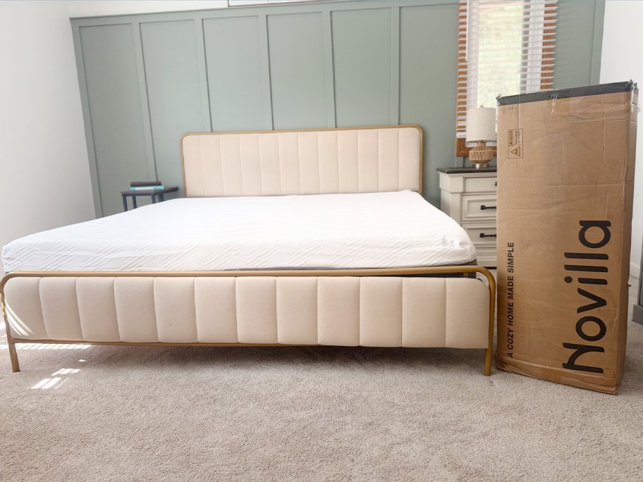 mattress on bed with novilla box next to it 