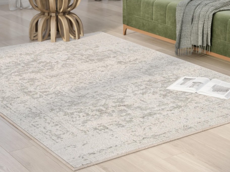 tan oriental rugs on hardwood floor