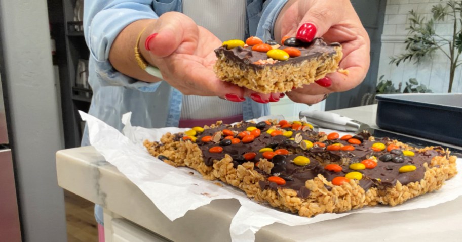 picking up homemade oatmeal kudos bars
