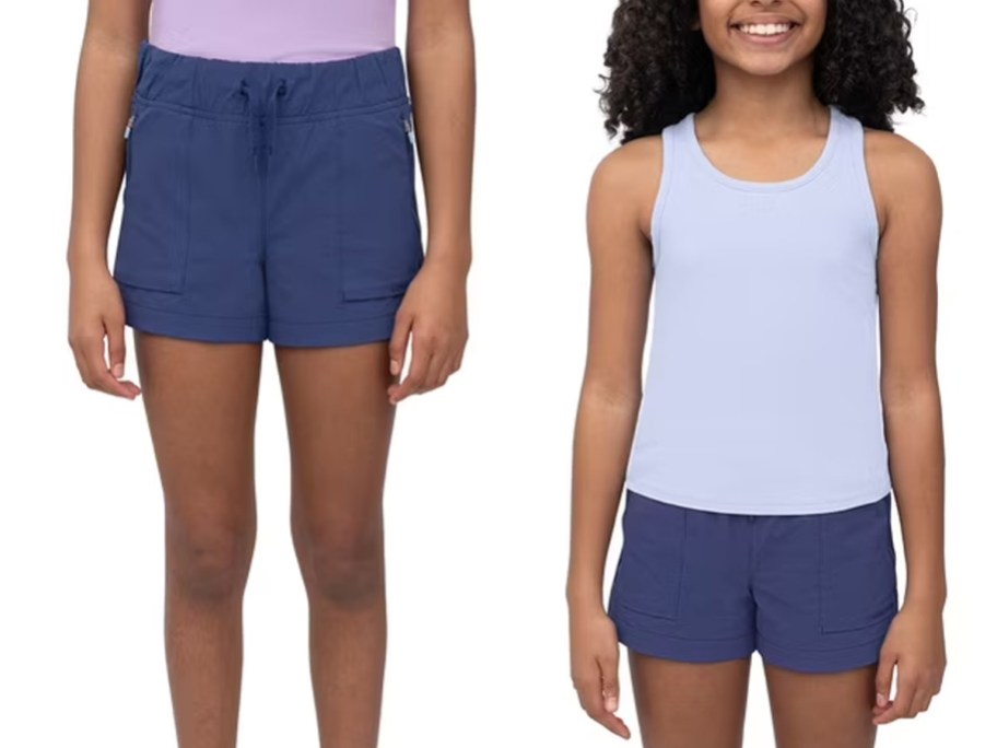 girls wearing blue shorts and purple top