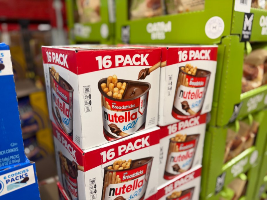 Stacked 16-pack boxes of Nutella & GO! with breadsticks displayed on a store shelf.