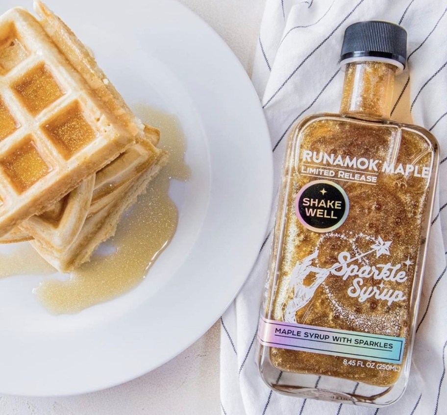 bottle of sparkle syrup on table with waffles
