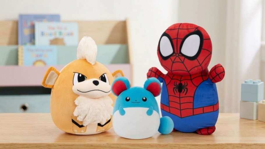 three squishmallows on a toy room bench