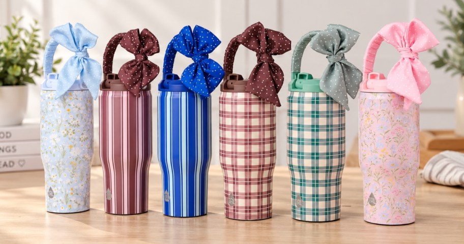 tumblers with scarves tied on the handles