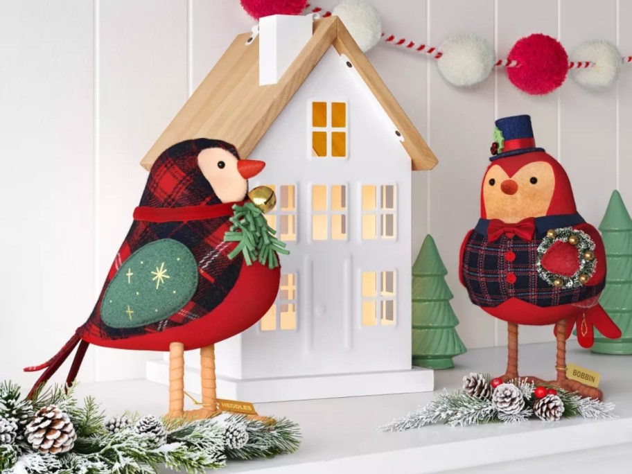 two fabric birds in a tabletop Christmas display