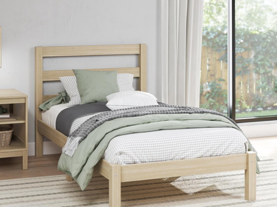 wooden bed in a bedroom