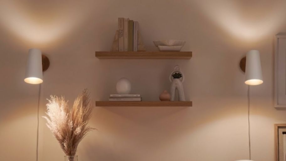 two White long wall sconces on each side of a wall