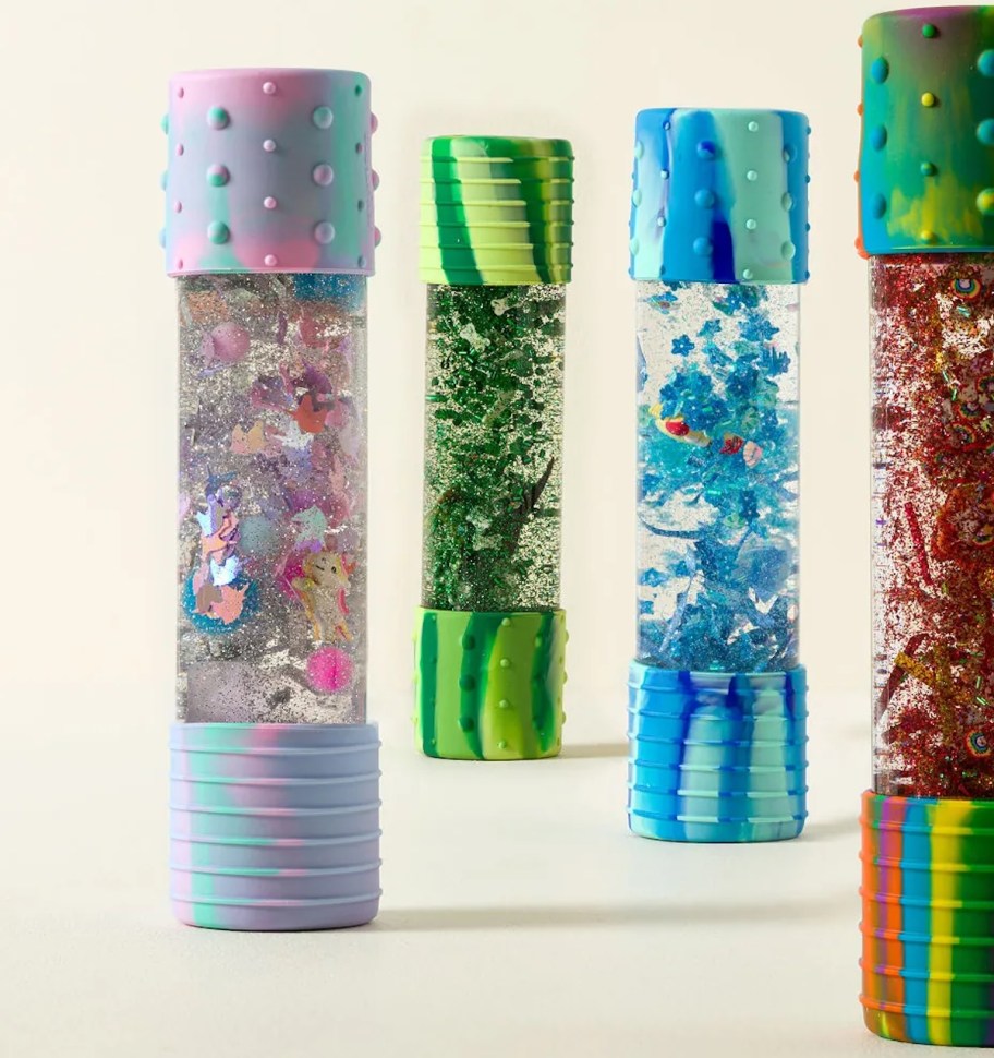 four bottles of sensory glitter 