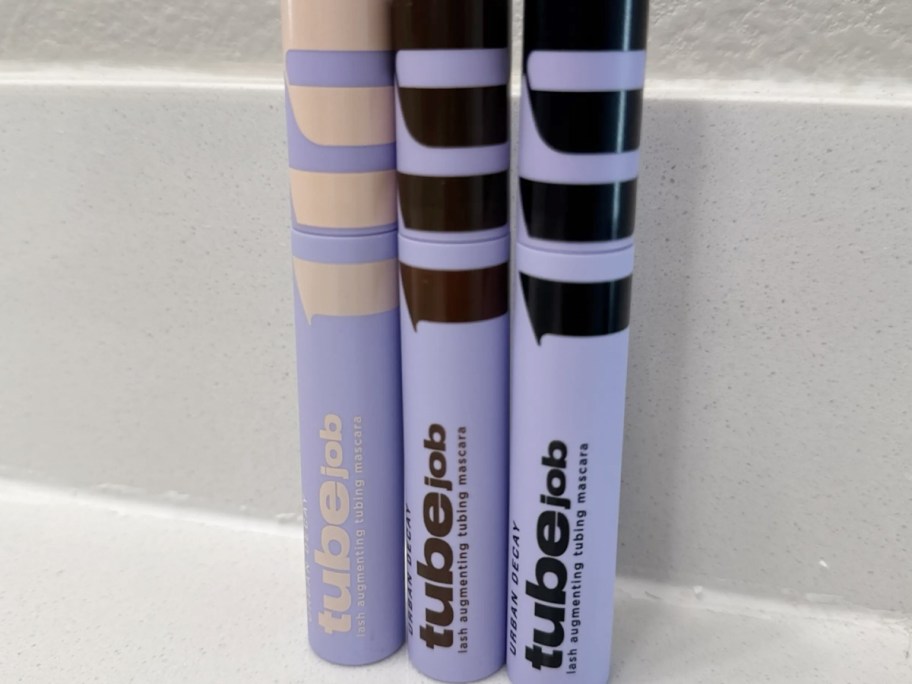 three mascara tubes on counter 