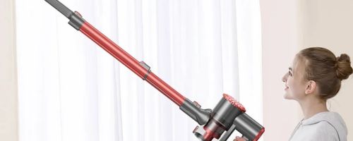 woman holding vacuum with extender