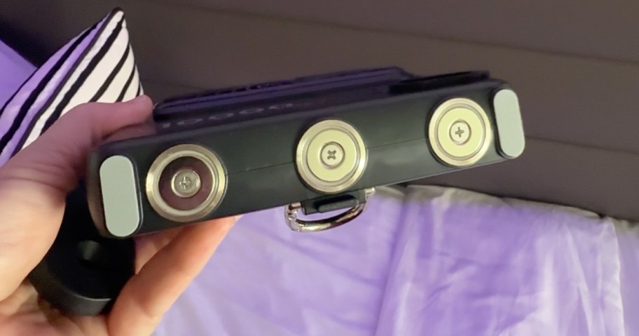 showing magnetic back to a black portable fan