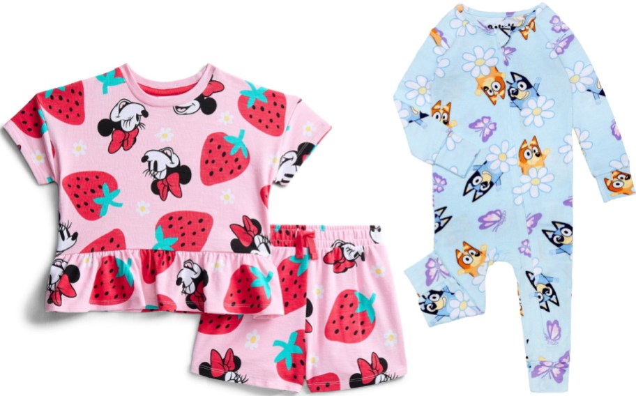 Children's character apparel shown side by side, featuring a pink Minnie Mouse strawberry-print short-sleeve top and shorts set on the left and a light blue Bluey patterned onesie on the right.