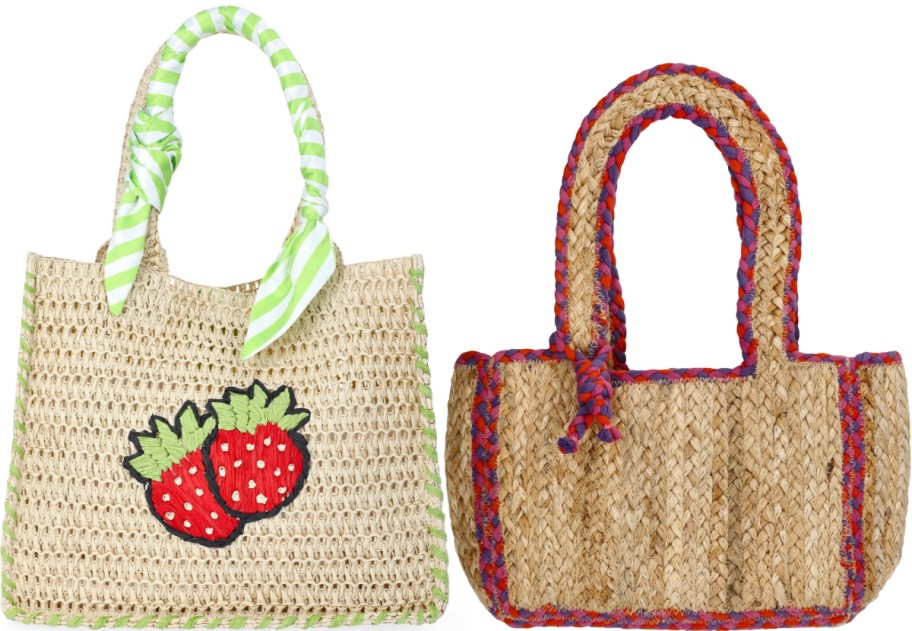 Two woven straw tote bags shown side by side, featuring a bag with a strawberry patch and a green-striped handle scarf on the left and a bag with braided red, purple, and orange trim and handles on the right.