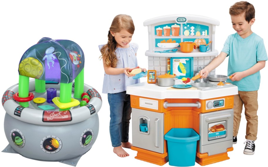 A space-themed inflatable ball pit or activity center on the left, and two children playing with a Little Tikes play kitchen on the right.