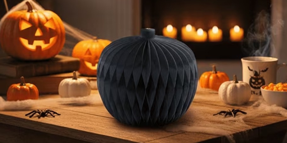 black honeycomb paper pumpkin on countertop 