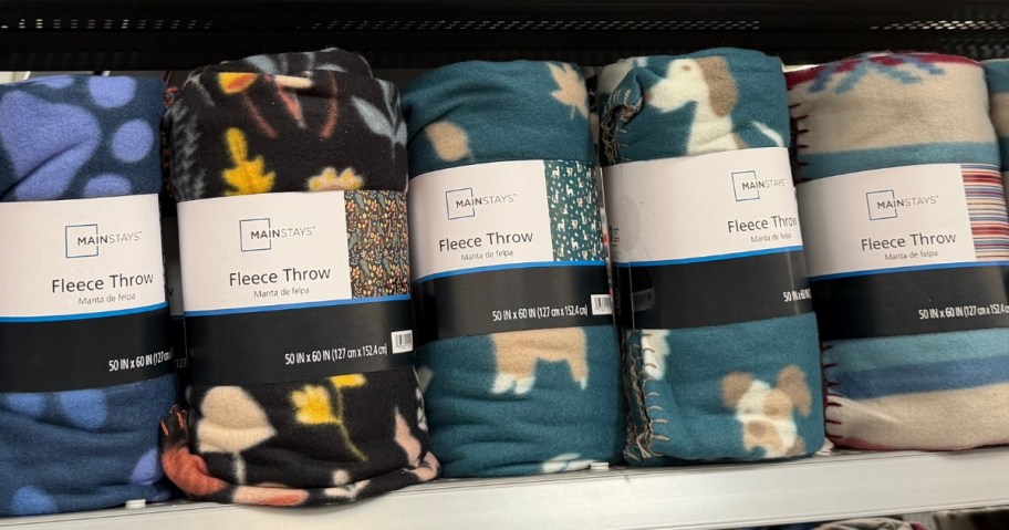 fleece blankets with fall prints on a Walmart shelf