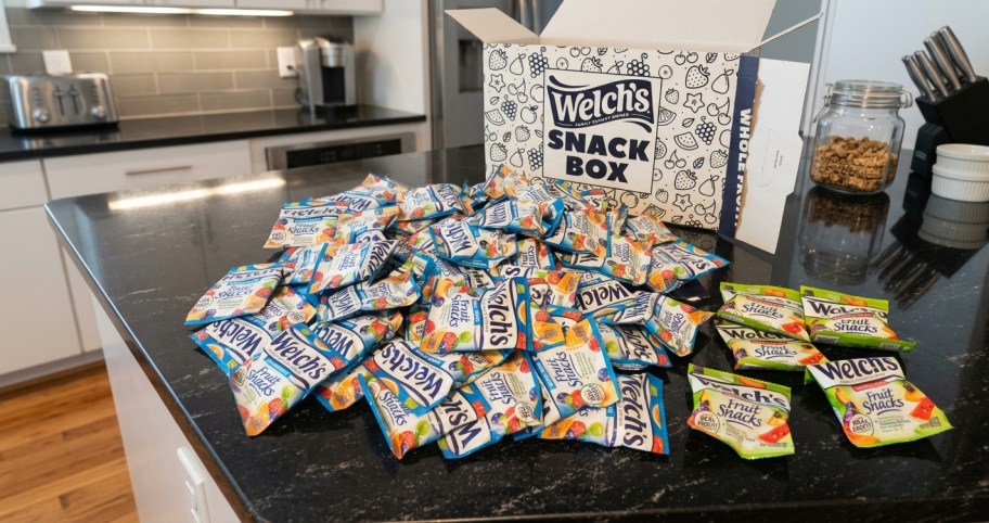 fruit snack packs on a kitchen counter next to a box