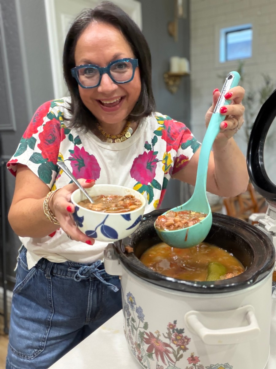 woman making beans from scratch in a slow cooker